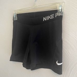Women's black Nike Pros, small